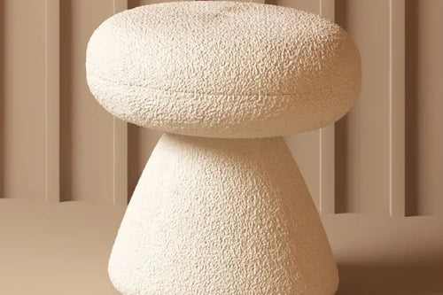 Cream pouf stool with minimalist conical base