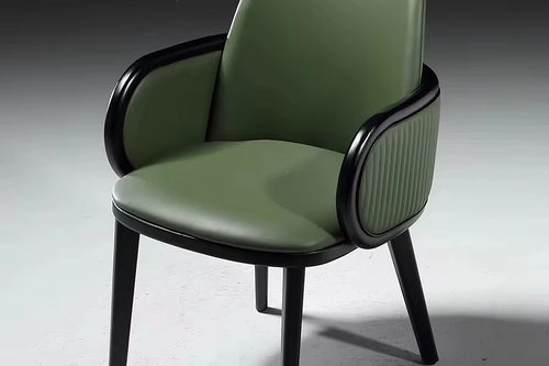 Hirdo dining chair in green with wooden legs.