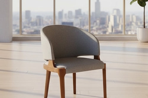 Elevate your space with the Eros Dining Chair. A modern upholstered cafe chair with an ergonomic curve, sturdy wood frame, and timeless mid-century style.