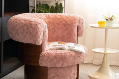 Discover the Ackor Chair — a luxurious swivel accent chair featuring soft fur upholstery and a rich veneer frame. Perfect for modern homes and stylish interiors. Luxury Accent Chairs Online by Chair Collective