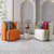 Two modern armchairs, orange and white with gold frames