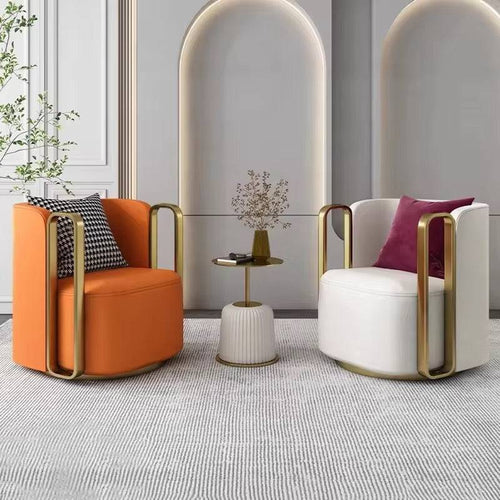 Two modern armchairs, orange and white with gold frames