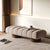 Side angle of Ottoman showing plush pillowed segments.