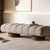 Angled perspective of soft-touch Arco Ottoman