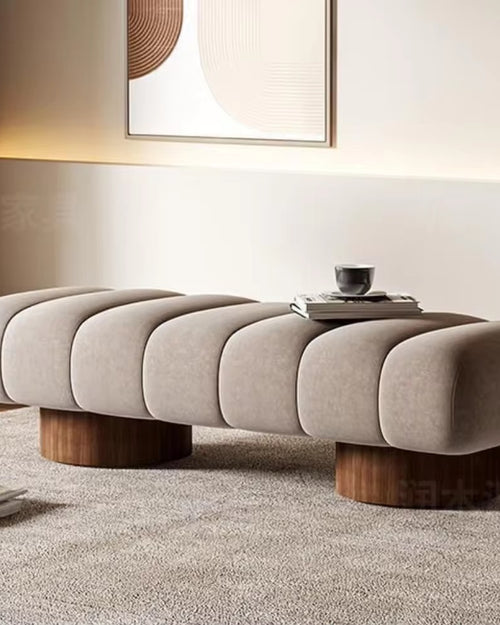 Angled perspective of soft-touch Arco Ottoman