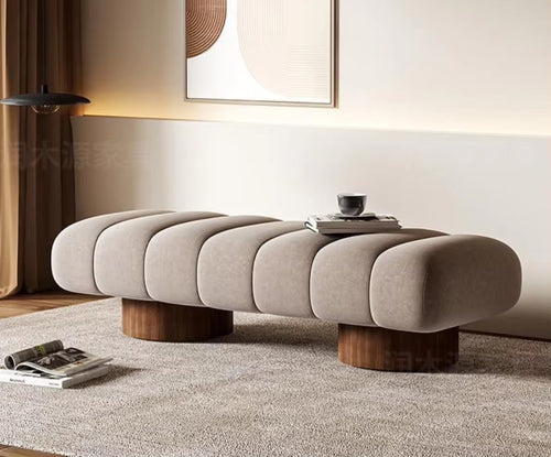 Angled perspective of soft-touch Arco Ottoman