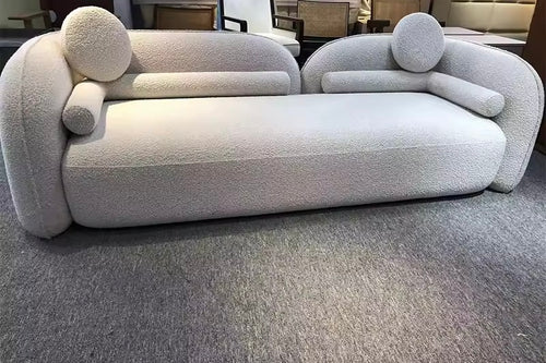 Arlao Couch is a modern luxury sofa with a twin back frame design and ultra-soft cushioning. A sculptural statement couch perfect for contemporary living rooms and premium interiors.