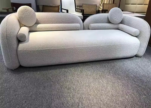 Arlao Couch is a modern luxury sofa with a twin back frame design and ultra-soft cushioning. A sculptural statement couch perfect for contemporary living rooms and premium interiors.