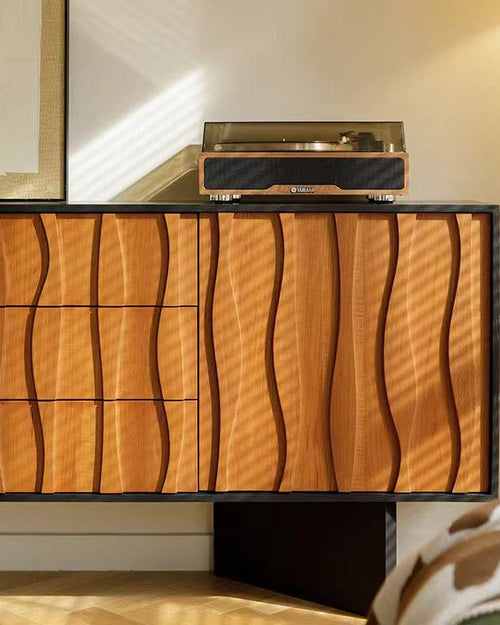 Wavy wood cabinet with matte black base.