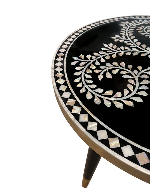 Closeup view of Round table with black surface