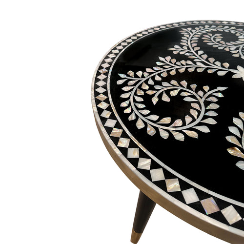 Closeup view of Round table with black surface