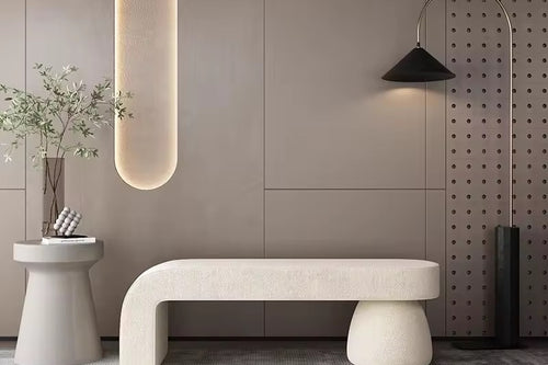 Kiana Ottoman with neutral tones and soft curves