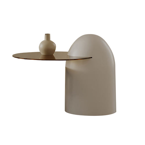 Modern side table with a cylindrical base and curved surface
