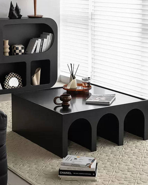 Black Noreme coffee table with Roman arch cutouts Design
