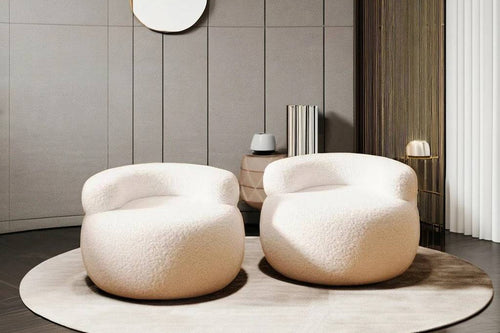 Two Brady chairs in white, with a round shape 