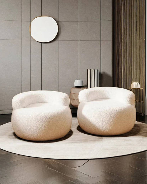 Two Brady chairs in white, with a round shape 