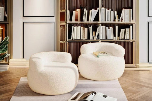 Pair of white Brady Chairs arranged in a cozy library-style room 