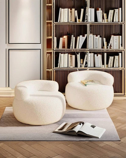 Pair of white Brady Chairs arranged in a cozy library-style room 