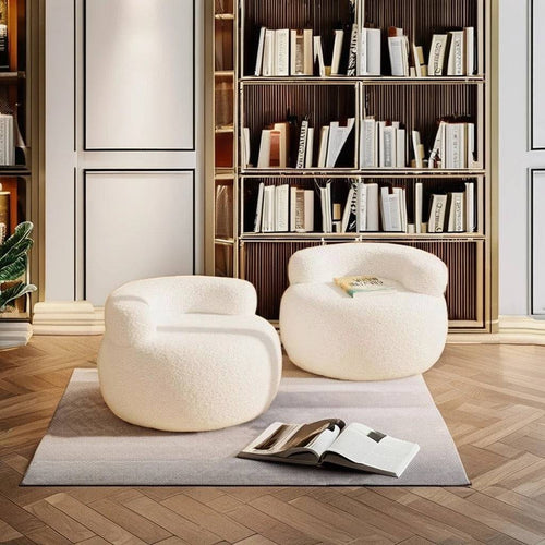 Pair of white Brady Chairs arranged in a cozy library-style room 