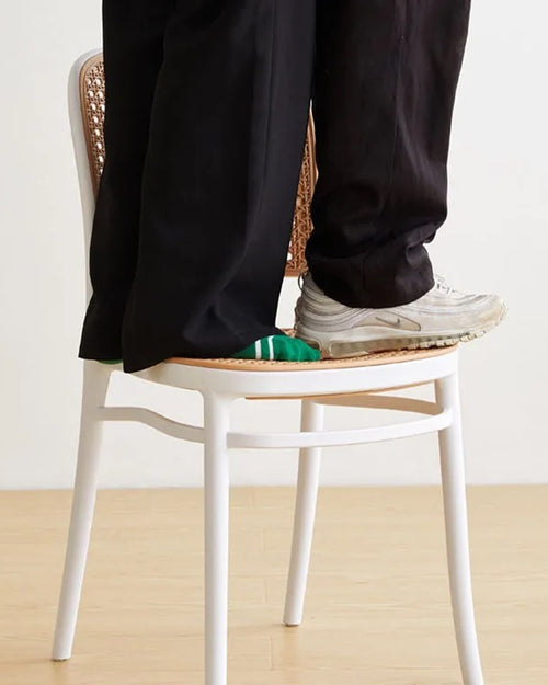 White Bubbles Stackable Chair demonstrating its strength and durability