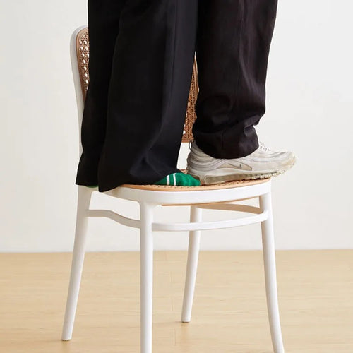 White Bubbles Stackable Chair demonstrating its strength and durability