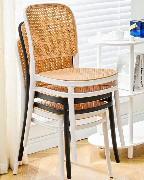 Stack of white and black Bubbles Stackable Chairs