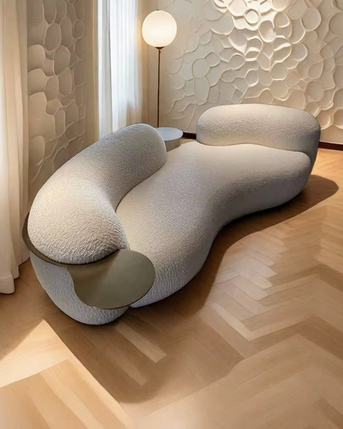 Castello Luxury Couch with PVD Gold SS Tray—an artistic, sculptural statement sofa crafted for premium modern interiors. Elegant curves, rich texture, and refined comfort. Luxury Sofa and Couch by Chair Collective