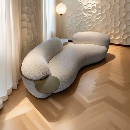 Castello Luxury Couch with PVD Gold SS Tray—an artistic, sculptural statement sofa crafted for premium modern interiors. Elegant curves, rich texture, and refined comfort. Luxury Sofa and Couch by Chair Collective