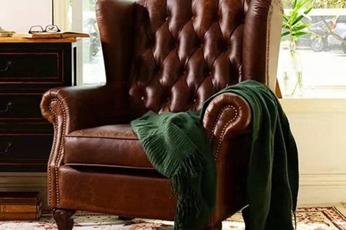 Brown Chester Chair with classic quilting and button detailing