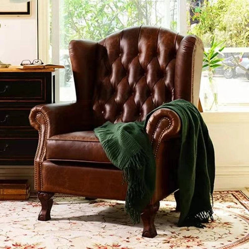Brown Chester Chair with classic quilting and button detailing