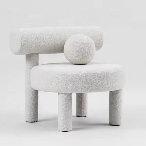 Shop the Cindy Bouclé Accent Chair, a luxury sculptural chair fully upholstered in bouclé with playful design details. Perfect for modern and high-end interiors.