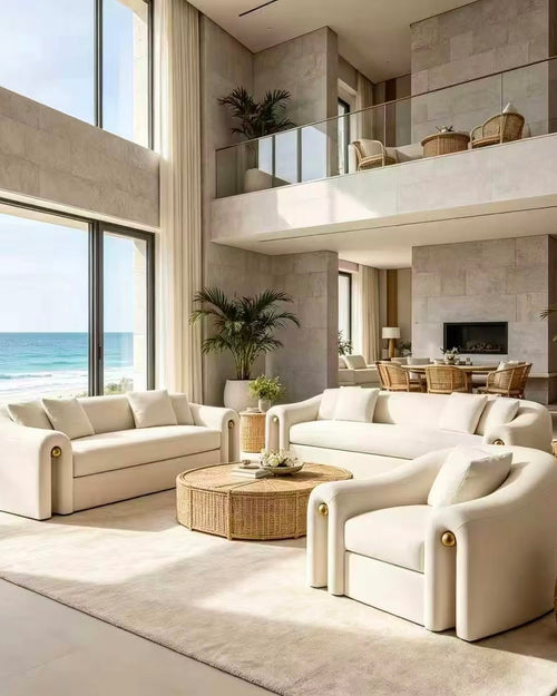 Julius Sofa by Chair Collective featuring a refined upholstered silhouette, gently rounded edges, comfortable seating, and elegant metallic accent details.