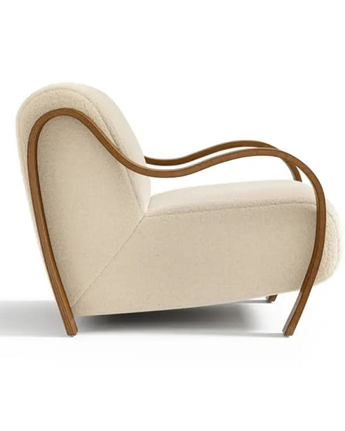 Side view of Corby chair with curved wooden arms