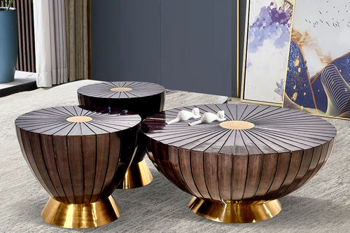 Set of three decorative side tables with gold bases.