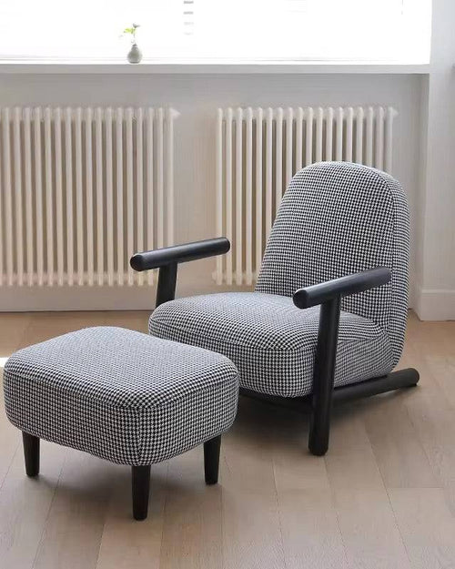 Gray armchair with black legs and matching ottoman 