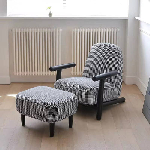 Gray armchair with black legs and matching ottoman 