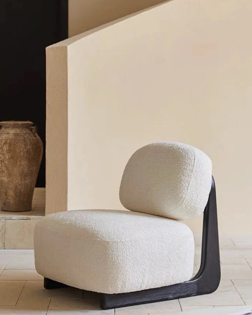 Side profile of armless lounge chair