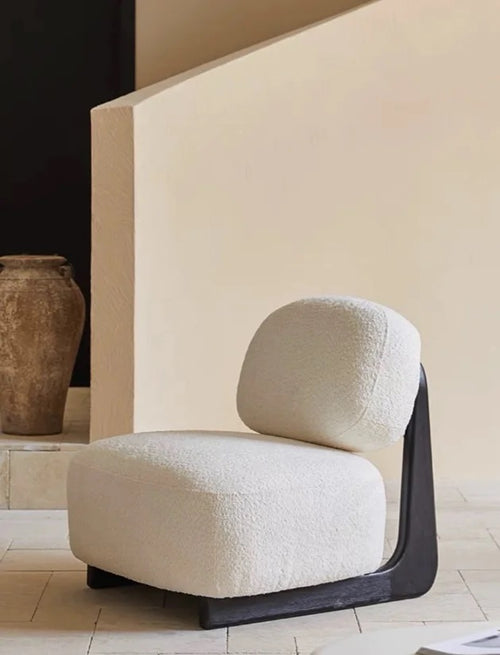 Side profile of armless lounge chair