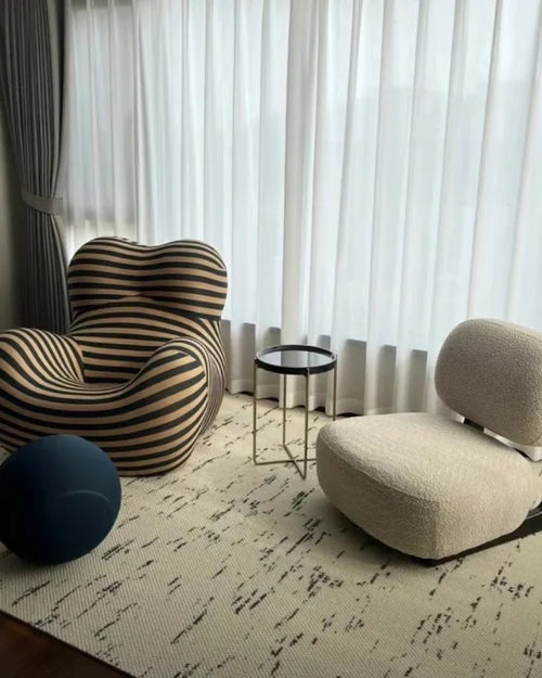 Dally Armless Lounge Chair from different angles and in various settings