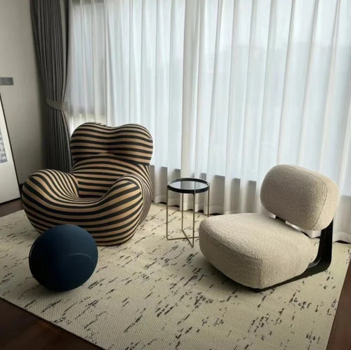 Dally Armless Lounge Chair from different angles and in various settings
