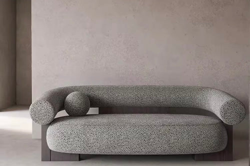 Damian Japandi sofa with curved bolster arms and textured upholstery on wooden base