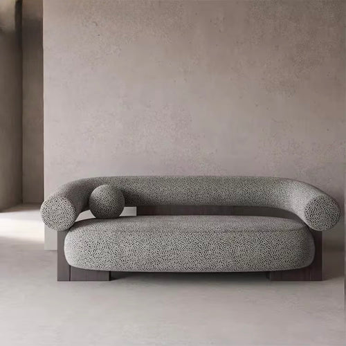 Damian Japandi sofa with curved bolster arms and textured upholstery on wooden base