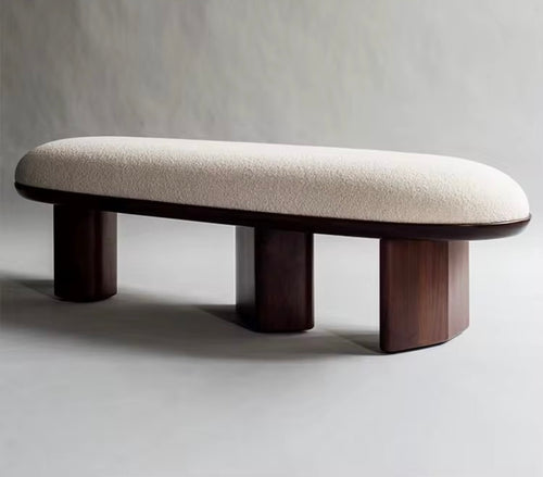 Shop the Dasaki Ottoman by Chair Collective — a sculptural 5-foot ottoman featuring boucle upholstery and a solid wood base. The perfect luxury accent for contemporary interiors in India.