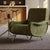 Green chair with ergonomic design and sturdy metal legs.