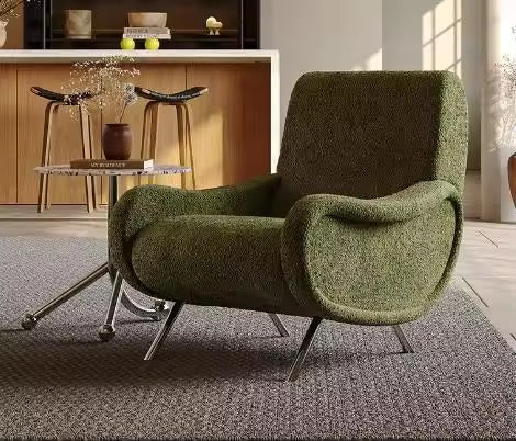 Green chair with ergonomic design and sturdy metal legs.