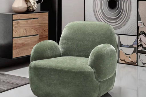 Plush Dinkum chair with sculpted arms.
