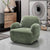 Plush Dinkum chair with sculpted arms.