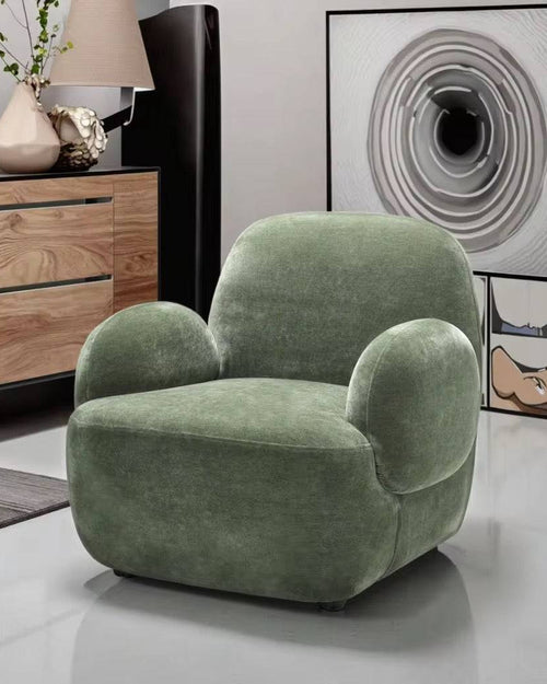 Plush Dinkum chair with sculpted arms.