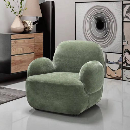 Plush Dinkum chair with sculpted arms.