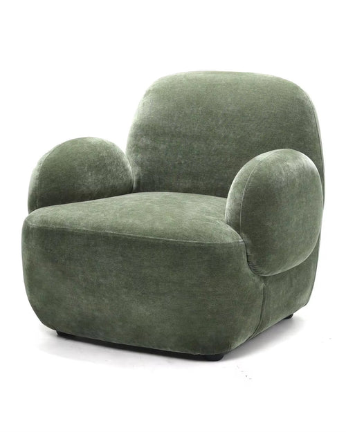 Dinkum chair with green plush and rounded form